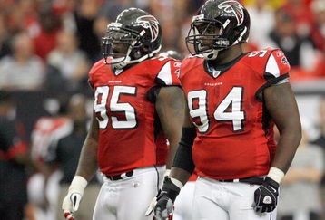 ATLANTA - OCTOBER 12:  Jonathan Babineaux #95 and Kindel Moorehead #94 of the Atlanta Falcons stand on the field during the game against the Chicago Bears at the Georgia Dome on October 12, 2008 in Atlanta, Georgia.  (Photo by Kevin C. Cox/Getty Images)