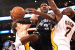 LOS ANGELES - APRIL 12: O.J. Mayo #32 of the Memphis Grizzlies goes up for a shot against Lamar Odom #7 of the Los Angeles Lakers on April 12, 2009 at Staples Center in Los Angeles, California. The Lakers won 92-75. NOTE TO USER: User expressly acknowledges and agrees that, by downloading and/or using this Photograph, user is consenting to the terms and conditions of the Getty Images License Agreement. (Photo by Stephen Dunn/Getty Images)