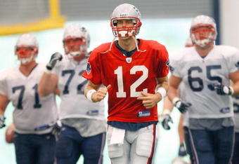 FOXBORO, MA - JULY 24:  Tom Brady #12 of the New England Patriots participates in a drill during the first day of training camp at Gillette Stadium on July 24, 2008 in Foxboro, Massachusetts.  (Photo by Jim Rogash/Getty Images)