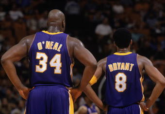 30 Jan 2002:  This is a close up of center Shaquille O''Neal (L) #34 of the Los Angeles Lakers and his teammate, guard Kobe Bryant (R). The picture was taken during the NBA game against the Orlando Magic at the TD Waterhouse in Orlando, Florida.  The Lakers defeated the Magic 111-93.  NOTE TO USER:  User expressly acknowledges and agrees that, by downloading and/or using this Photograph, User is consenting to the terms and conditions of the Getty Images License Agreement. Mandatory copyright notice Mandatory Credit: Andy Lyons/Getty Images
