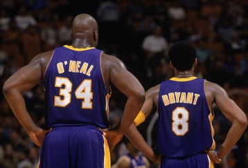 30 Jan 2002:  This is a close up of center Shaquille O''Neal (L) #34 of the Los Angeles Lakers and his teammate, guard Kobe Bryant (R). The picture was taken during the NBA game against the Orlando Magic at the TD Waterhouse in Orlando, Florida.  The Lakers defeated the Magic 111-93.  NOTE TO USER:  User expressly acknowledges and agrees that, by downloading and/or using this Photograph, User is consenting to the terms and conditions of the Getty Images License Agreement. Mandatory copyright notice Mandatory Credit: Andy Lyons/Getty Images