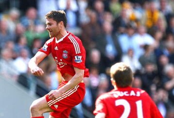 HULL, UNITED KINGDOM - APRIL 25:  Xabi Alonso of Liverpool jumps for joy as he celebrates the opening goal during the Barclays Premier League match between Hull City and Liverpool at the KC Stadium on April 25, 2009 in Hull, England.  (Photo by Laurence Griffiths/Getty Images)