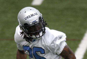 ALLEN PARK, MI - MAY 01:  Louis Delmas #26 of the Detroit Lions looks for a pass during rookie orientation camp at the Detroit Lions Headquarters and Training Facility on May 1, 2009 in Allen Park, Michigan.  (Photo by Gregory Shamus/Getty Images)
