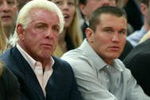 NEW YORK - MARCH 9:  WWE wrestlers (L-R) Triple H, Ric Flair, Randy Orton and Batista sit courtside at the New York Knicks v Boston Celtics  NBA game March 9, 2004 at Madison Square Garden in New York City.   (Photo by Ray Amati/Getty Images)