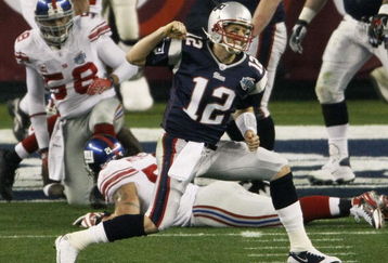 GLENDALE, AZ - FEBRUARY 03:  Quarterback Tom Brady #12 of the New England Patriots celebrates a second quarter touchdown against the New York Giants during Super Bowl XLII on February 3, 2008 at the University of Phoenix Stadium in Glendale, Arizona.  (Photo by Win McNamee/Getty Images)