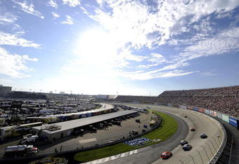 DOVER, DE - SEPTEMBER 21:  Drivers race past the grandstand during the NASCAR Sprint Cup Series Camping World RV 400 at Dover International Speedway on September 21, 2008 in Dover, Delaware.  (Photo by Jeff Zelevansky/Getty Images for NASCAR)