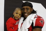 ATLANTA - DECEMBER 28:  Wide receiver Roddy White #84 of the Atlanta Falcons celebrates on the sidelines after defeating the St. Louis Rams at Georgia Dome on December 28, 2008 in Atlanta, Georgia.  The Falcons defeated the Rams 31-27.  (Photo by Doug Benc/Getty Images)