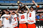 FOXBOROUGH, MA - MAY 25:  Spencer Van Schaack #12, Pat Perritt #1, Kenny Nims #10, Matt Abbott #3 of Syracuse Orange celebrate after defeating the Cornell Big Red, 10-9, in overtime for NCAA Division I Lacrosse Championship at Gillette Stadium May 25, 2009 in Foxborough, Massachusetts.  (Photo by Jim Rogash/Getty Images)