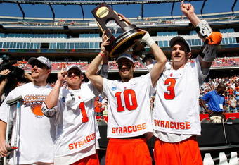 FOXBOROUGH, MA - MAY 25:  Spencer Van Schaack #12, Pat Perritt #1, Kenny Nims #10, Matt Abbott #3 of Syracuse Orange celebrate after defeating the Cornell Big Red, 10-9, in overtime for NCAA Division I Lacrosse Championship at Gillette Stadium May 25, 2009 in Foxborough, Massachusetts.  (Photo by Jim Rogash/Getty Images)