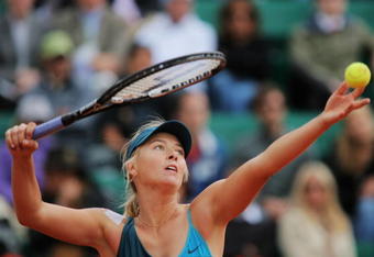 PARIS - MAY 27:  Maria Sharapova of Russia serves during her Women's Singles Second Round match against Nadia Petrova of Russia on day four of the French Open at Roland Garros on May 27, 2009 in Paris, France.  (Photo by Matthew Stockman/Getty Images)