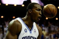 ORLANDO, FL - MAY 26:  Dwight Howard #12 of the Orlando Magic reacts after dunking against the Cleveland Cavaliers in Game Four of the Eastern Conference Finals during the 2009 NBA Playoffs at the Amway Arena on May 26, 2009 in Orlando, Florida. NOTE TO USER: User expressly acknowledges and agrees that, by downloading and or using this photograph, User is consenting to the terms and conditions of the Getty Images License Agreement.  (Photo by Elsa/Getty Images)