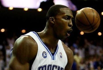 ORLANDO, FL - MAY 26:  Dwight Howard #12 of the Orlando Magic reacts after dunking against the Cleveland Cavaliers in Game Four of the Eastern Conference Finals during the 2009 NBA Playoffs at the Amway Arena on May 26, 2009 in Orlando, Florida. NOTE TO USER: User expressly acknowledges and agrees that, by downloading and or using this photograph, User is consenting to the terms and conditions of the Getty Images License Agreement.  (Photo by Elsa/Getty Images)