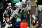 IRVING, TX - NOVEMBER 27:  Wide receiver Roy Williams #11 of the Dallas Cowboys is tackled by Julian Peterson #98 of the Seattle Seahawks at Texas Stadium on November 27, 2008 in Irving, Texas.  (Photo by Ronald Martinez/Getty Images)