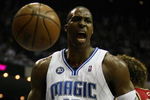 ORLANDO, FL - MAY 24:  Dwight Howard #12 of the Orlando Magic reacts after a dunk against the Cleveland Cavaliers in Game Three of the Eastern Conference Finals during the 2009 NBA Playoffs at the the Amway Arena on May 24, 2009 in Orlando, Florida. NOTE TO USER: User expressly acknowledges and agrees that, by downloading and or using this photograph, User is consenting to the terms and conditions of the Getty Images License Agreement.  (Photo by Elsa/Getty Images)