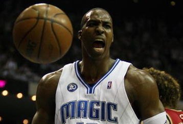 ORLANDO, FL - MAY 24:  Dwight Howard #12 of the Orlando Magic reacts after a dunk against the Cleveland Cavaliers in Game Three of the Eastern Conference Finals during the 2009 NBA Playoffs at the the Amway Arena on May 24, 2009 in Orlando, Florida. NOTE TO USER: User expressly acknowledges and agrees that, by downloading and or using this photograph, User is consenting to the terms and conditions of the Getty Images License Agreement.  (Photo by Elsa/Getty Images)