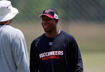TAMPA, FL - MAY 01:  Head coach Raheem Morris of the Tampa Bay Buccaneers talks with a coach during the Buccaneers Rookie Minicamp at One Buccaneer Place on May 1, 2009 in Tampa, Florida.  (Photo by J. Meric/Getty Images)