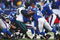 EAST RUTHERFORD, NJ -  JANUARY 11:  Eli Manning #10 of the New York Giants is tackled by Mike Patterson #98 of the Philadelphia Eagles during the NFC Divisional Playoff Game on January 11, 2009 at Giants Stadium in East Rutherford, New Jersey.  The Eagles defeated the Giants 23 -11. (Photo by Chris McGrath/Getty Images)