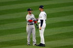 NEW YORK - MAY 05:  Derek Jeter #2 of the New York Yankees talks with Dustin Pedroia #15 of the Boston Red Sox prior to their game on May 5, 2009 at Yankee Stadium in the Bronx borough of New York City.  (Photo by Jim McIsaac/Getty Images)