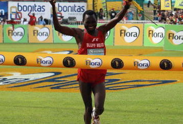 DURBAN, SOUTH AFRICA - 24 MAY:  Stephen Muzhingi of Zimbabwe finishes in first place during the Comrades Marathon between Durban and Pietermaritzburg on May 24, 2009 in Durban, South Africa.  (Photo by Anesh Debiky/Gallo Images/Getty Images)
