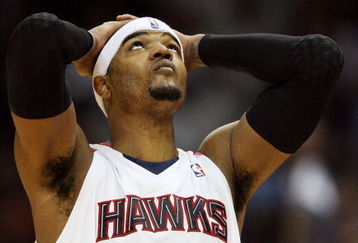 ATLANTA - MAY 03:  Josh Smith #5 of the Atlanta Hawks takes a moment and looks up with less than a minute to play against the Miami Heat during Game Seven of the Eastern Conference Quarterfinals at Philips Arena on May 3, 2009 in Atlanta, Georgia. The Hawks defeated the Heat 91-78. NOTE TO USER: User expressly acknowledges and agrees that, by downloading and/or using this Photograph, user is consenting to the terms and conditions of the Getty Images License Agreement.  (Photo by Doug Benc/Getty Images)