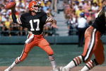 SAN DIEGO - SEPTEMBER 25:  Quarterback Brian Sipe #17 of the Cleveland Browns throws a pass under the protection of offensive tackle Cody Risien #63 during a game against the San Diego Chargers at Jack Murphy on September 25, 1983 in San Diego, California.  The Browns won 30-24 in overtime. (Photo by George Rose/Getty Images)