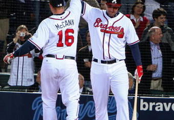 ATLANTA - MARCH 31: Catcher Brian McCann #16 of the Atlanta Braves is congratulated by right fielder Jeff Francoeur #7 after McCann's home run during the game against the Pittsburgh Pirates at Turner Field March 31, 2008 in Atlanta, Georgia.  The Pirates beat the Braves 12-11 in 12 innings. (Photo by Mike Zarrilli/Getty Images)