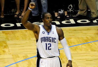ORLANDO, FL - MAY 26:  Dwight Howard #12 of the Orlando Magic celebrates during overtime against the Cleveland Cavaliers in Game Four of the Eastern Conference Finals during the 2009 NBA Playoffs at the Amway Arena on May 26, 2009 in Orlando, Florida. The Orlando Magic defeated the Cleveland Cavaliers 116-114. NOTE TO USER: User expressly acknowledges and agrees that, by downloading and or using this photograph, User is consenting to the terms and conditions of the Getty Images License Agreement.  (Photo by Sam Greenwood/Getty Images)