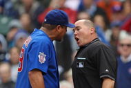 CHICAGO - MAY 27: Carlos Zambrano #38 of the Chicago Cubs argues with home plate umpire Mark Carlson #48 after a play at the plate in the 7th inning with Zambrano and Nyjer Morgan of the Pittsburgh Pirates on May 27, 2009 at Wrigley Field in Chicago, Illinois. The Cubs defeated the Pirates 5-2. (Photo by Jonathan Daniel/Getty Images)
