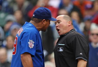 CHICAGO - MAY 27: Carlos Zambrano #38 of the Chicago Cubs argues with home plate umpire Mark Carlson #48 after a play at the plate in the 7th inning with Zambrano and Nyjer Morgan of the Pittsburgh Pirates on May 27, 2009 at Wrigley Field in Chicago, Illinois. The Cubs defeated the Pirates 5-2. (Photo by Jonathan Daniel/Getty Images)