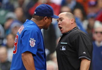 CHICAGO - MAY 27: Carlos Zambrano #38 of the Chicago Cubs argues with home plate umpire Mark Carlson #48 after a play at the plate in the 7th inning with Zambrano and Nyjer Morgan of the Pittsburgh Pirates on May 27, 2009 at Wrigley Field in Chicago, Illinois. The Cubs defeated the Pirates 5-2. (Photo by Jonathan Daniel/Getty Images)