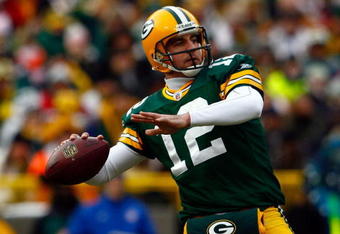 GREEN BAY, WI - DECEMBER 07:  Quarterback Aaron Rodgers #12 of the Green Bay Packers drops back to pass against the Houston Texans during the first quarter at Lambeau Field on December 7, 2008 in Green Bay, Wisconsin.  (Photo by Jeff Gross/Getty Images)