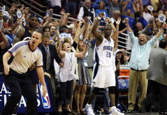 ORLANDO, FL - MAY 26:  Mickael Pietrus #20 of the Orlando Magic and fans celebrate their 116-114 victory over the Cleveland Cavaliers in Game Four of the Eastern Conference Finals during the 2009 NBA Playoffs at the Amway Arena on May 26, 2009 in Orlando, Florida. NOTE TO USER: User expressly acknowledges and agrees that, by downloading and or using this photograph, User is consenting to the terms and conditions of the Getty Images License Agreement.  (Photo by Elsa/Getty Images)