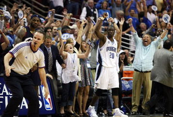 ORLANDO, FL - MAY 26:  Mickael Pietrus #20 of the Orlando Magic and fans celebrate their 116-114 victory over the Cleveland Cavaliers in Game Four of the Eastern Conference Finals during the 2009 NBA Playoffs at the Amway Arena on May 26, 2009 in Orlando, Florida. NOTE TO USER: User expressly acknowledges and agrees that, by downloading and or using this photograph, User is consenting to the terms and conditions of the Getty Images License Agreement.  (Photo by Elsa/Getty Images)