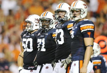 AUBURN, AL - SEPTEMBER 20:  Offensive lineman Ryan Pugh #50, Tyronne Green #71, Lee Ziemba #73 and tight end Tommy Trott #5 of the Auburn Tigers prepare for a play while taking on the LSU Tigers at Jordan-Hare Stadium on September 20, 2008 in Auburn, Alabama. LSU defeated Auburn 26-21.  (Photo by Doug Benc/Getty Images)