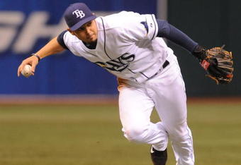 ST. PETERSBURG, FL - APRIL 30: Shortstop Jason Bartlett #8 of the Tampa Bay Rays fields a short infield ball that was the Boston Red Sox only hit April 30, 2009 at Tropicana Field in St. Petersburg, Florida.  (Photo by Al Messerschmidt/Getty Images)