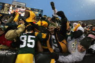 GREEN BAY, WI - JANUARY 12:  Wide receiver Greg Jennings #85 of the Green Bay Packers celebrates with a 'Lambeau leap' after catching a two-yard touchdown pass in the second quarter against the Seattle Seahawks during the NFC divisional playoff game on January 12, 2008 at Lambeau Field in Green Bay, Wisconsin.  (Photo by Jonathan Daniel/Getty Images)