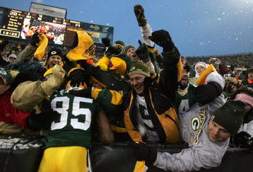 GREEN BAY, WI - JANUARY 12:  Wide receiver Greg Jennings #85 of the Green Bay Packers celebrates with a 'Lambeau leap' after catching a two-yard touchdown pass in the second quarter against the Seattle Seahawks during the NFC divisional playoff game on January 12, 2008 at Lambeau Field in Green Bay, Wisconsin.  (Photo by Jonathan Daniel/Getty Images)