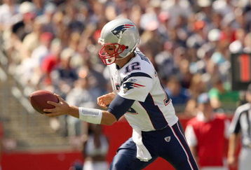 FOXBORO, MA - SEPTEMBER 7:  Quarterback Tom Brady #12 of the New England Patriots looks to hand off the ball during their NFL game against the Kansas City Chiefs on September 7, 2008 at Gillette Stadium in Foxboro, Massachusetts. The Patriots defeated the Chiefs 17-10. (Photo by Elsa Garrison/Getty Images)