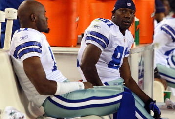 PHILADELPHIA - DECEMBER 28:  Roy Williams #11 and Terrell Owens #81 of the Dallas Cowboys sit on the bench late in the game against the Philadelphia Eagles on December 28, 2008 at Lincoln Financial Field in Philadelphia, Pennsylvania. The Eagles defeated the Cowboys 44-6.  (Photo by Jim McIsaac/Getty Images)