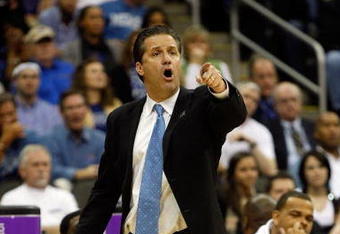 KANSAS CITY, MO - MARCH 21:  Head Coach John Calipari of the Memphis Tigers points a finger from the sideline during their second round game against the Maryland Terrapins in the NCAA Division I Men's Basketball Tournament at the Sprint Center on March 21, 2009 in Kansas City, Missouri. The Tigers defeated the Terrapins 89-70.  (Photo by Jamie Squire/Getty Images)