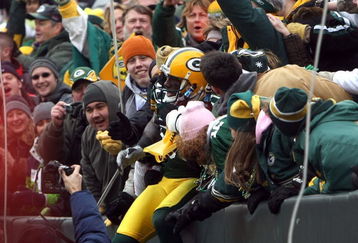 GREEN BAY, WI - NOVEMBER 30:  Donald Driver #80 of the Green Bay Packers performs a 'Lambeau Leap' as he celebrates with fans after scoring a 6-yard touchdown reception in the second quarter against the Carolina Panthers at Lambeau Field on November 30, 2008 in Green Bay, Wisconsin.  (Photo by Jonathan Daniel/Getty Images)