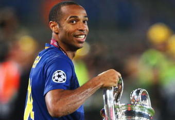 ROME - MAY 27:  Thierry Henry of Barcelona holds the trophy as he celebrates winning the UEFA Champions League Final match between Manchester United and Barcelona at the Stadio Olimpico on May 27, 2009 in Rome, Italy.  (Photo by Laurence Griffiths/Getty Images)