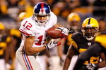PITTSBURGH - OCTOBER 26: Steve Smith #12 of the New York Giants makes a catch between Deshea Townsend #26 and Tyrone Carter #23 of the Pittsburgh Steelers on October 26, 2008 at Heinz Field in Pittsburgh, Pennsylvania. The Giants won 21-14. (Photo by Rick Stewart/Getty Images)