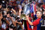 ROME, ITALY - MAY 27:  Andres Iniesta of Barcelona celebrates with the trophy after the UEFA Champions League Final match between Barcelona and Manchester United at the Stadio Olimpico on May 27, 2009 in Rome, Italy.  (Photo by Claudio Villa/Getty Images)