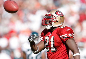 SAN FRANCISCO - OCTOBER 12:  Running back Frank Gore #21 of the San Francisco 49ers celebrates a 6-yard touchdown run against the Philadelphia Eagles during their game on October 12, 2008 at Candlestick Park in San Francisco, California. Philadelphia won 40-26.  (Photo by Greg Trott/Getty Images)