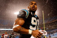 CHARLOTTE, NC - JANUARY 10: Julius Peppers #89 of the Carolina Panthers walks off the field in the rain after being defeated by the Arizona Cardinals 33-13 in the NFC Divisional Playoff Game on January 10, 2009 at Bank of America Stadium in Charlotte, North Carolina. (Photo by Streeter Lecka/Getty Images)