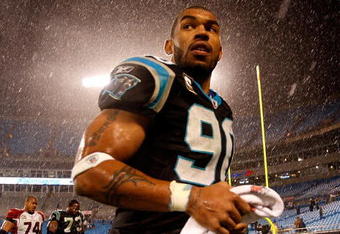 CHARLOTTE, NC - JANUARY 10:  Julius Peppers #89 of the Carolina Panthers walks off the field in the rain after being defeated by the Arizona Cardinals 33-13 in the NFC Divisional Playoff Game on January 10, 2009 at Bank of America Stadium in Charlotte, North Carolina.  (Photo by Streeter Lecka/Getty Images)