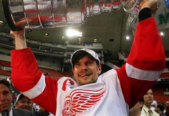 PITTSBURGH - JUNE 04: Nicklas Lidstrom #5 of the Detroit Red Wings celebrates with the Stanley Cup after defeating the Pittsburgh Penguins in game six of the 2008 NHL Stanley Cup Finals at Mellon Arena on June 4, 2008 in Pittsburgh. Pennsylvania. The Red Wings defeated the Penguins 3-2 to win the Stanley Cup Finals 4 games to 2. (Photo by Bruce Bennett/Getty Images)