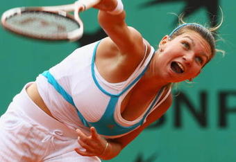 PARIS - JUNE 08:  Simona Halep of Romania serves during the Girl's Singles Final match against Elena Bogdan of Romania on day fifteen of the French Open at Roland Garros on June 8, 2008 in Paris, France.  (Photo by Julian Finney/Getty Images)