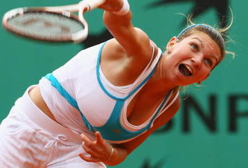 PARIS - JUNE 08:  Simona Halep of Romania serves during the Girl's Singles Final match against Elena Bogdan of Romania on day fifteen of the French Open at Roland Garros on June 8, 2008 in Paris, France.  (Photo by Julian Finney/Getty Images)